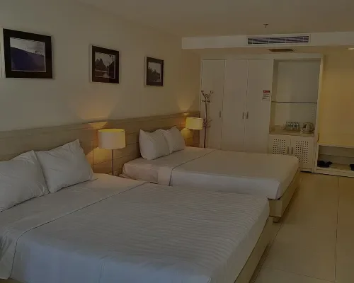 Phòng gia đình có hai giường lớn tại Nhi Phi Hotel Nha Trang